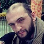 Теоман Хос